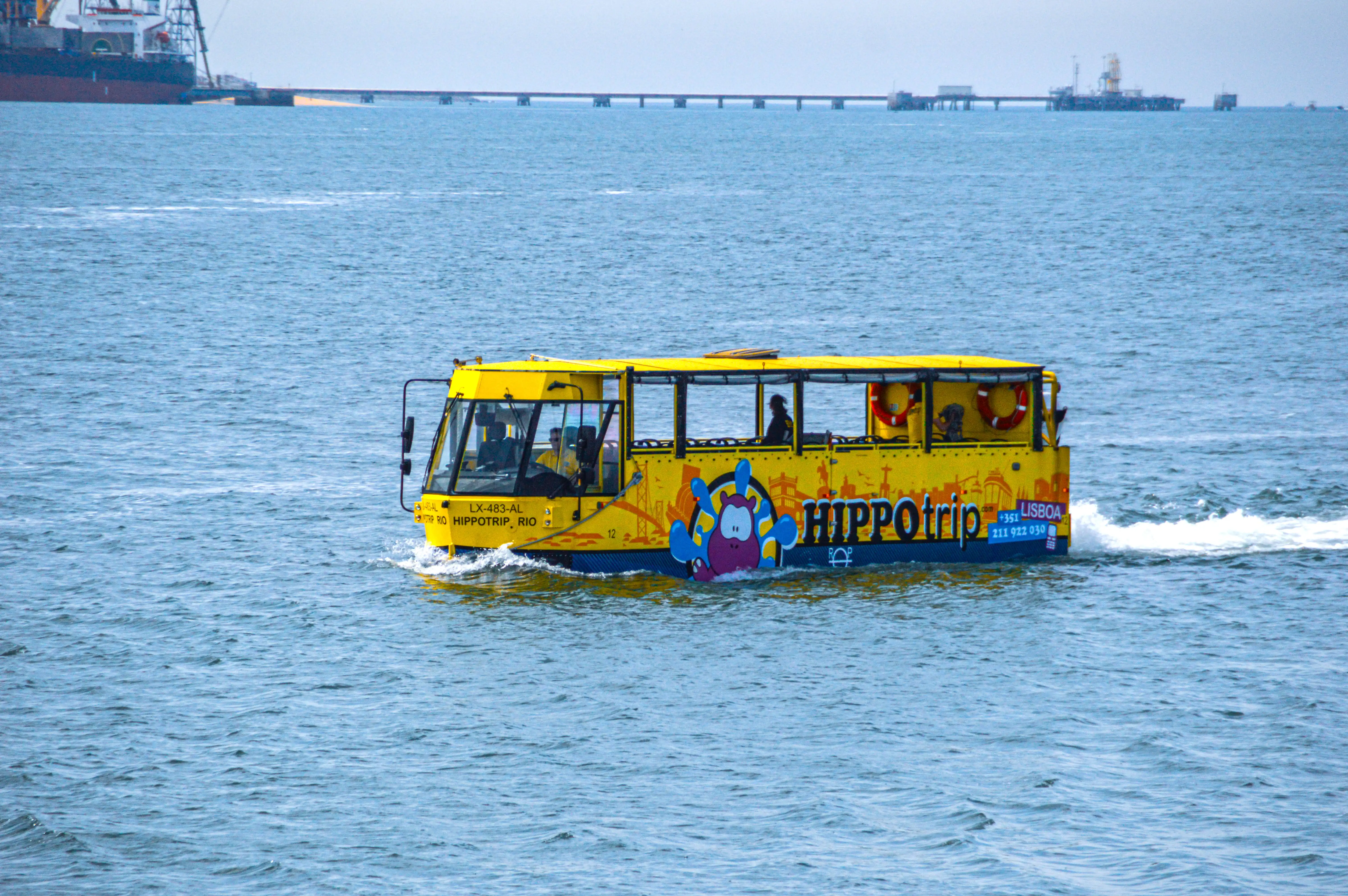 A yellow amphibious bus, branded 